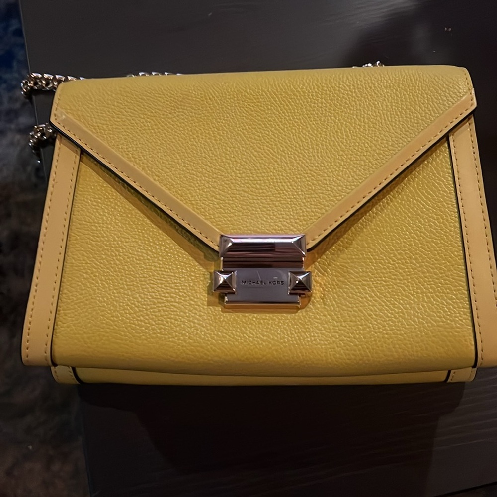 Michael Kors bag that is yellow. I am willing to negotiate down.